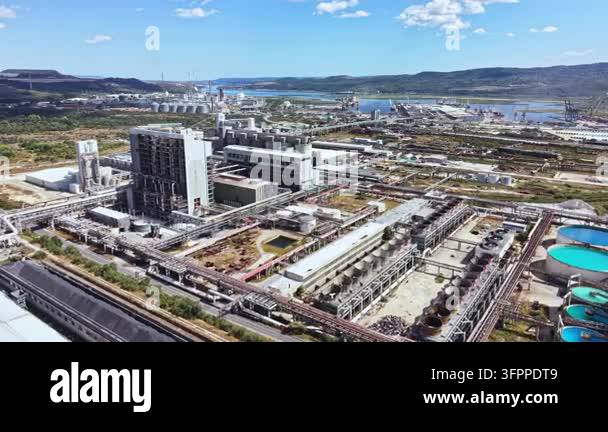 Several buildings and equipment are seen at an industrial site by a ...