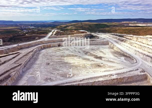 Large Area A mining site shows large areas of earth that have been excavated ...