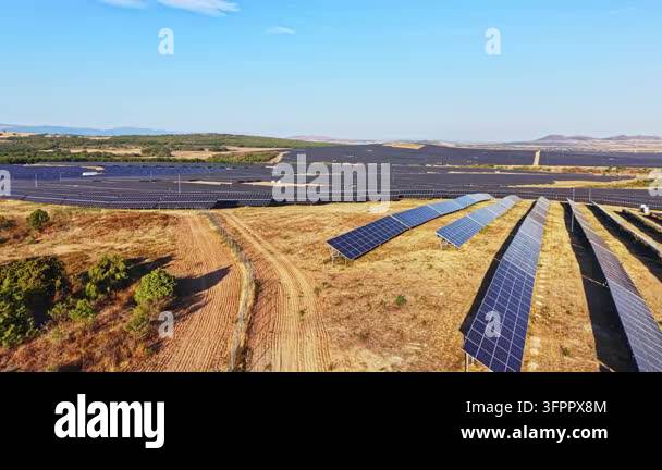 Large Area Large area covered with solar panels stretches across the land in a ...