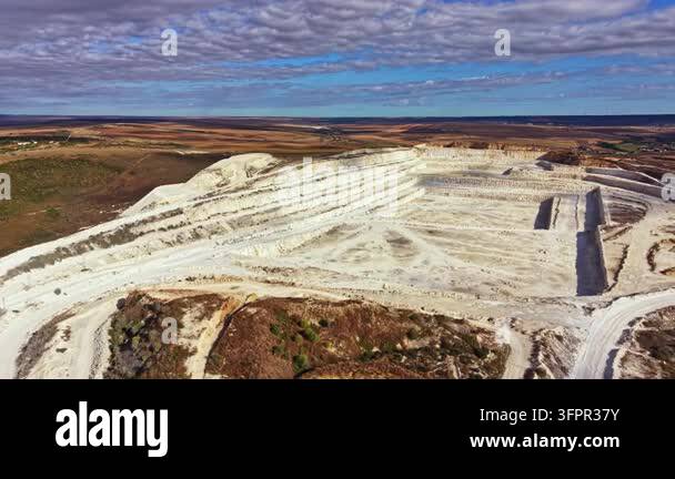 Large Area Aerial view shows a large mining site used for extracting minerals in a ...