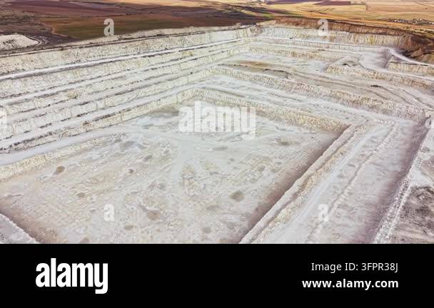 Large Area A large salt mining site is visible with distinct layers and structures ...