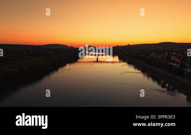 Html Olors The scene shows a river reflecting the colors of the sunset with a ...
