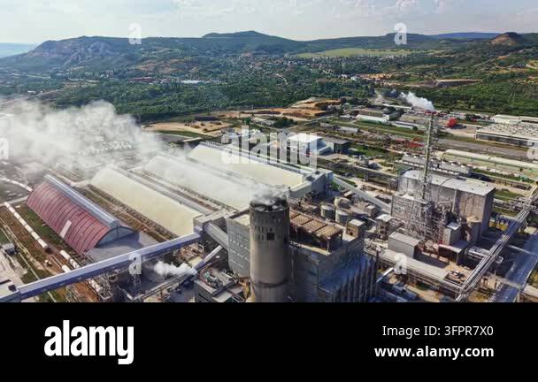 Large Area Factories and buildings are seen in a large industrial area. Smoke ...