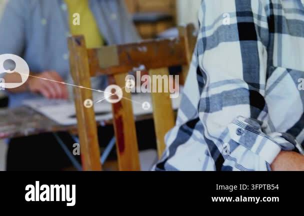Vertical video: Colleagues at desk man flipping papers as network ...