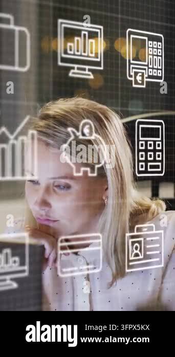 Vertical video: Analyst scanning monitor as finance icons appear ...