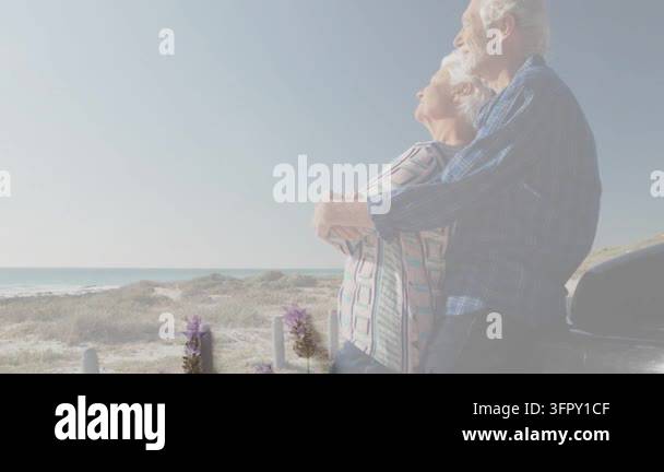 Overlay Html Over Video Senior couple embracing at dunes, overlay fading up over them with ...