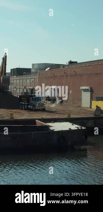 Front Loader Vector Graphics Vertical video: Heavy machinery and trucks in industrial site on ...