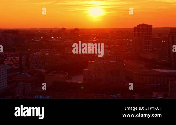 Golden sun over Boston cityscape at sunset. Aerial view captures First ...