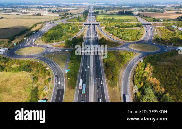 Aerial view of busy highway interchange with multiple lanes and ...
