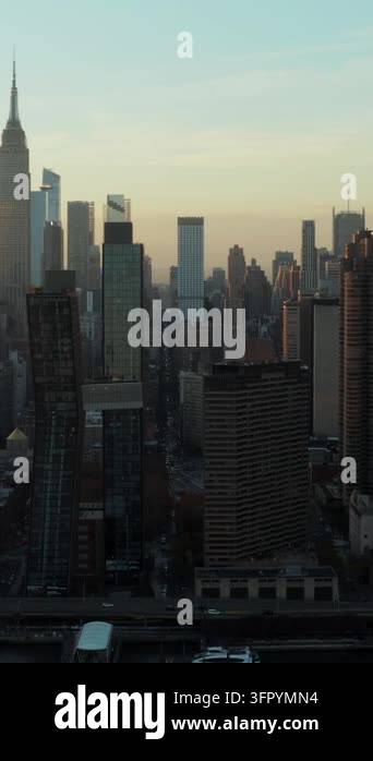 Vertical video: High rise buildings in midtown. Iconic Empire state ...