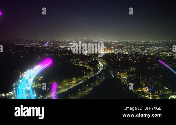 Smart city showing information flow with glowing digital light streams ...