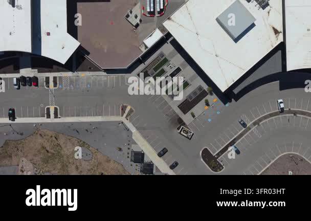 Top down drone camera flies over a large modern data center revealing ...