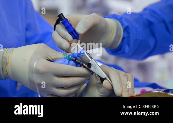 Medical Instrument Signage Two pairs of hand in white latex gloves hold the medical tool. Close up ...