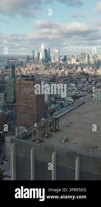 Vertical video: Panoramic aerial footage of cityscape. Downtown skyline ...