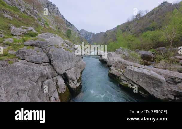Limestone In Rivers Jade green river squeezing through a narrow channel between limestone ...