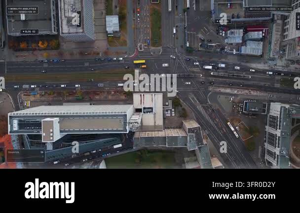 Top down aerial flyover of Berlin: cars and trams at a busy ...