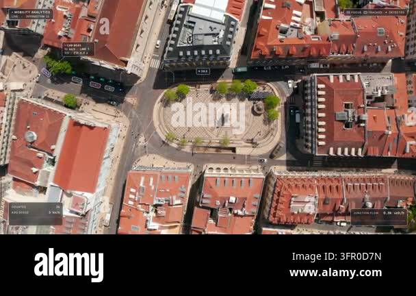 Top down aerial view of Lisbon: cars around Camoes Square, its monument ...