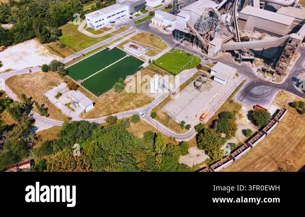 Service Processing Framework Industrial settling basins beside a cement processing plant. Top down ...