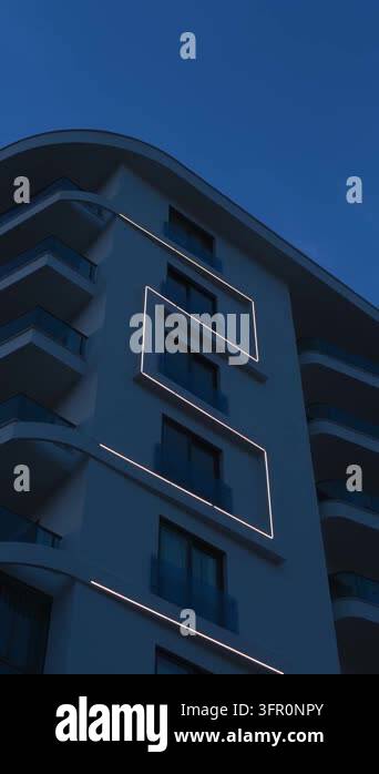 Upward view of a contemporary apartment building with illuminated ...