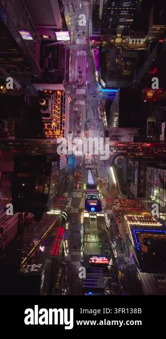 Vertical video: Illuminated Times Square in slow motion at night ...