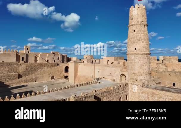 Ancient stone fortress and tower under a blue cloudy sky Stock Video ...