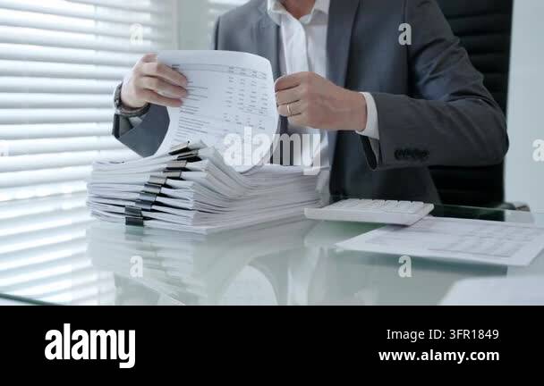 Customer Handling Documents Businessman analyzing financial documents, managing paperwork ...