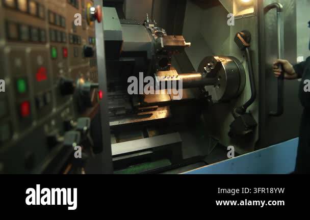 Video Production Control Panel Machine operator closing safety door CNC lathe, pressing start button ...