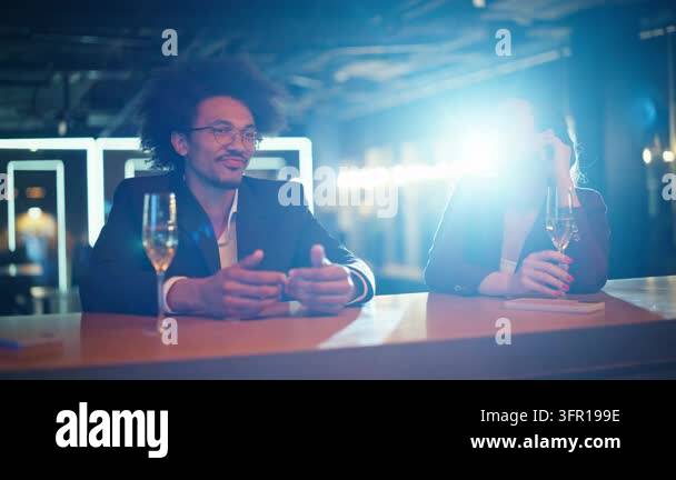 Corporate party celebration bar counter, man gesturing telling funny ...
