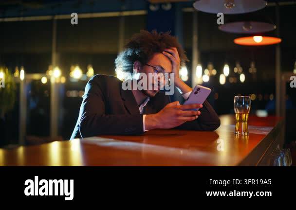 Exhausted business man resting head hand looking phone bar counter with ...