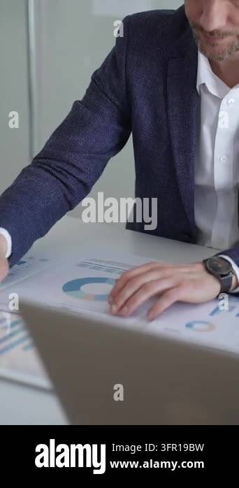 Corporate professional analyzing financial data and statistics ...