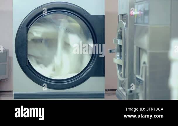 Service Processing Framework Industrial laundry machine rotating white fabric round glass door ...