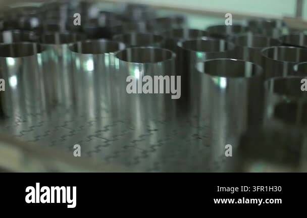 Polished steel molds moving conveyor dairy plant. Closeup metal ...