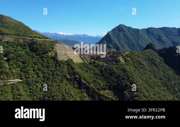 Majestic aerial view flying towards the ancient inca citadel of machu ...