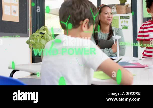 Boy writing while green overlay appearing adding turbine icons, teacher ...