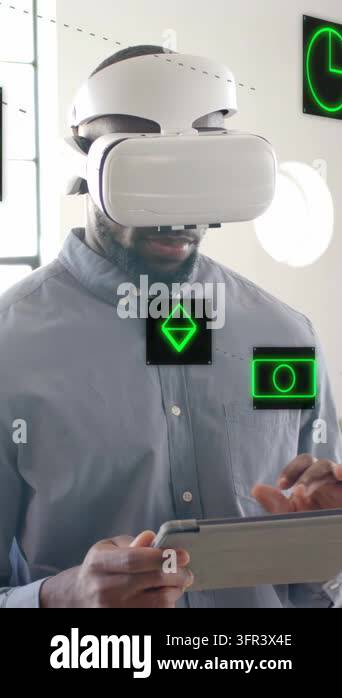 Vertical video: Man wearing VR headset tapping tablet testing VR ...