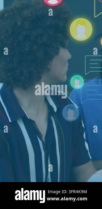 Vertical video: Curly man turning to colleague, causing chat icons ...