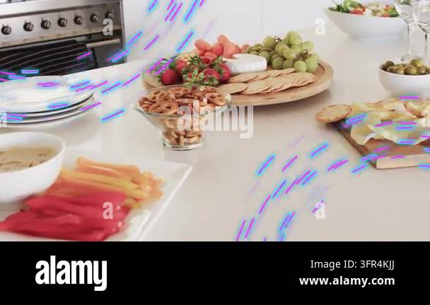 Camera panning right, food spread revealing cheese, glasses for party ...