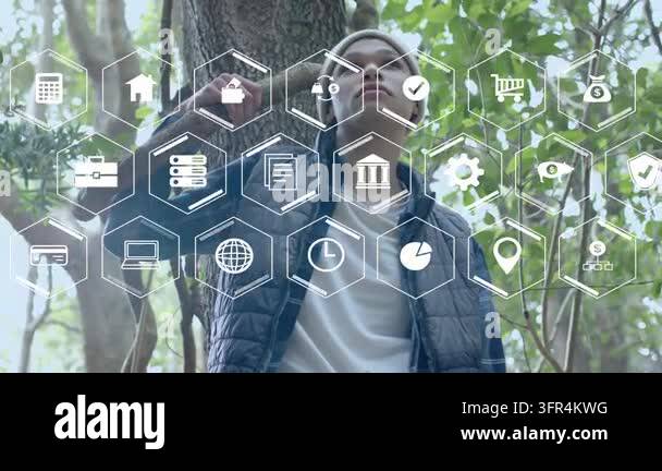 Man leaning on tree holding stick, hex icons appearing and man lifting ...