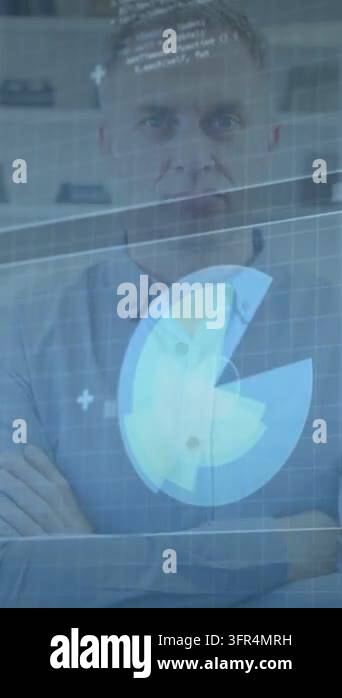 Standing man watching spinning-grid HUD rising over chest in office ...