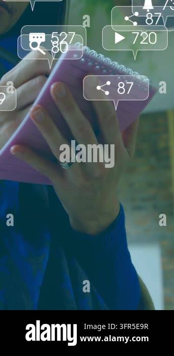 Man holding pink notepad and tapping pen, tracking social media metrics ...