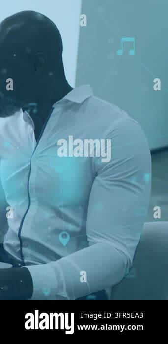 Man tapping device in office animating tech icons lock hiding hands ...