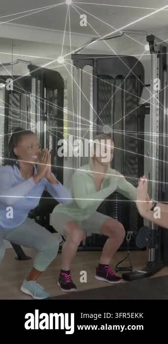 Vertical video: Two women doing squats on coach signal for fitness ...