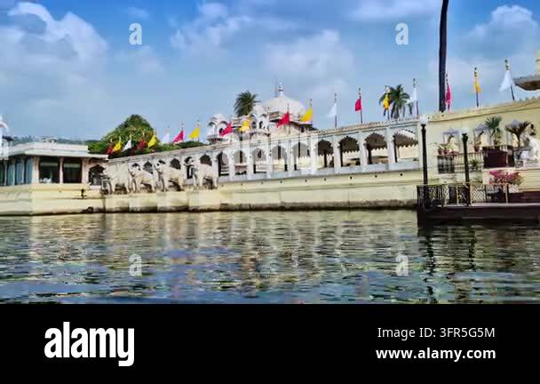 White elephant sculptures stand beneath flags along Jag Mandir's ...