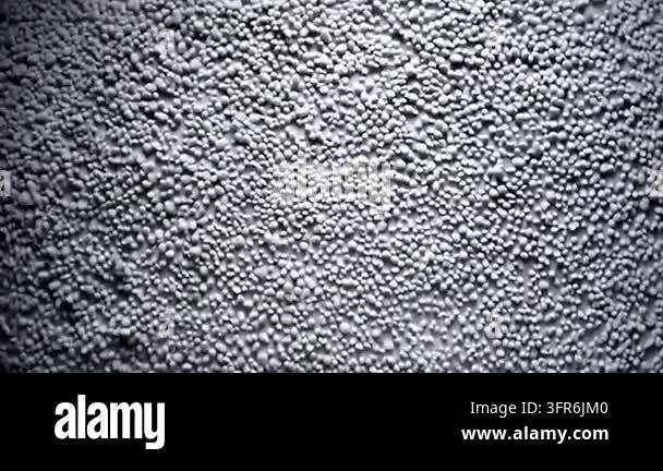 Textured surface covered with small gray spherical shapes Stock Video ...