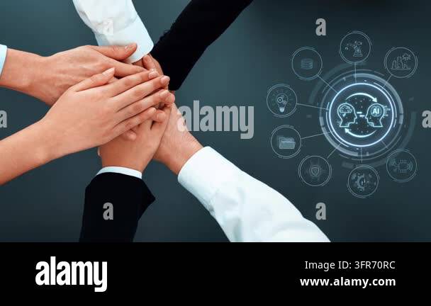 Hands of diverse individuals join together in a display of teamwork ...