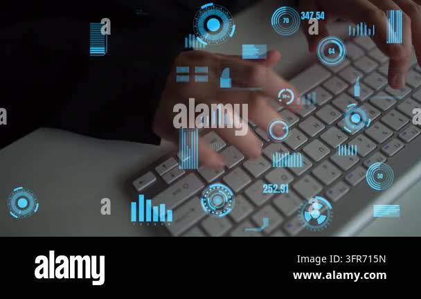 An individual types on a modern computer keyboard, surrounded by ...