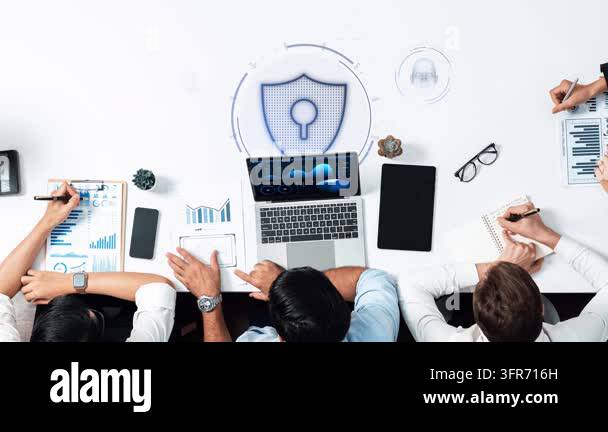 A diverse team collaborates on a cybersecurity project, surrounded by ...