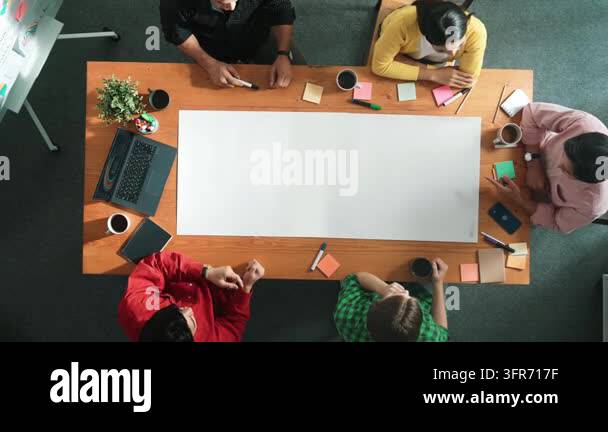 Top down aerial view of diverse business team designing and planning ...