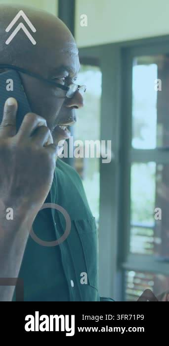 Animation of arrow and geometric shapes over senior man talking on ...