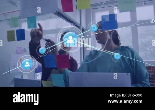 Colleagues pointing at notes on glass while animated blue network ...